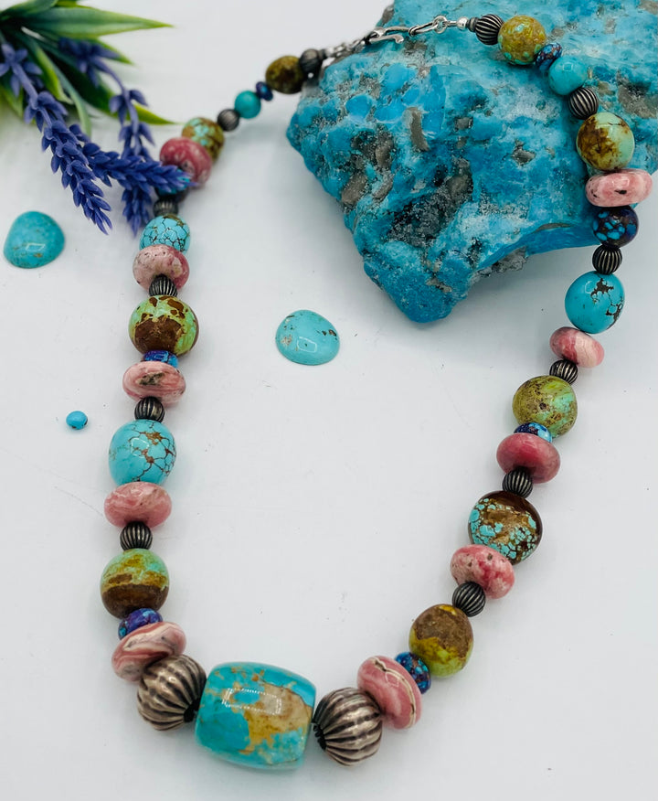 Beaded necklace featuring #8 turquoise, Kingman turquoise, purple Mojave turquoise, Rhodochrosite, and sterling silver beads. Available only from Rockstar Cowgirl online or  store in Cody, Wyoming.
