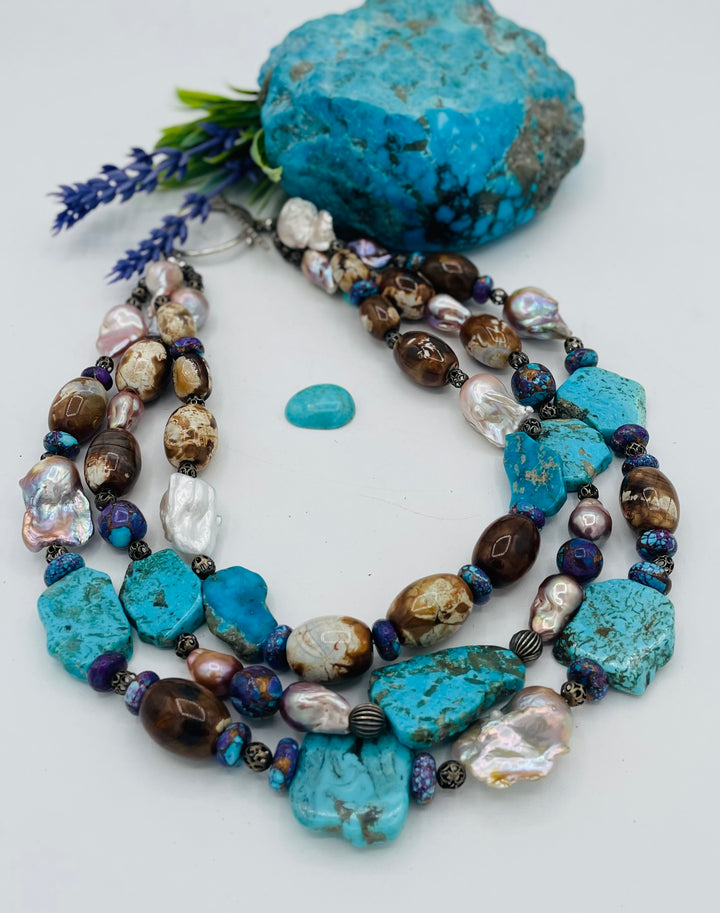 Beaded 3 strand necklace featuring Kingman turquoise slices, crazy lace agate, natural luster baroque pearls, and sterling silver beads. Available only from Rockstar Cowgirl online or in store in Cody, Wyoming.