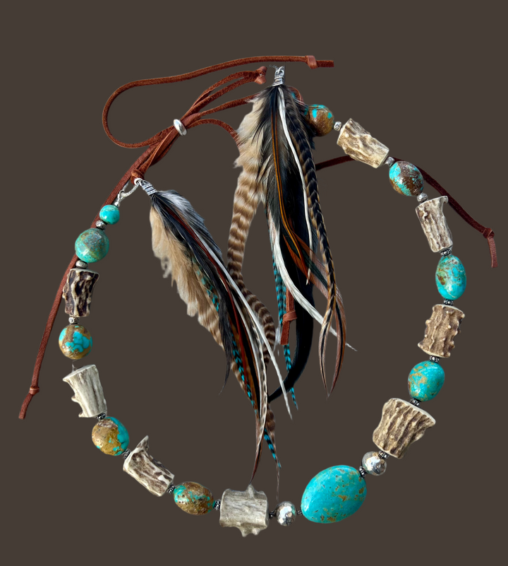 Rustic hatband featuring Kingman turquoise nuggets, Hill tribe sterling silver beads, knobby deer antler beads, and feathers with deer lace and  sliding bead in back. Available only from Rockstar Cowgirl online or in store in Cody, Wyoming.