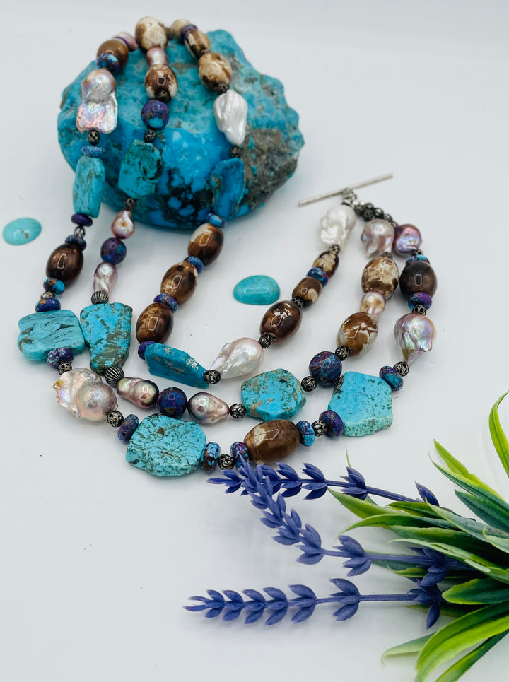 Beaded 3 strand necklace featuring Kingman turquoise slices, crazy lace agate, natural luster baroque pearls, and sterling silver beads. Available only from Rockstar Cowgirl online or in store in Cody, Wyoming.