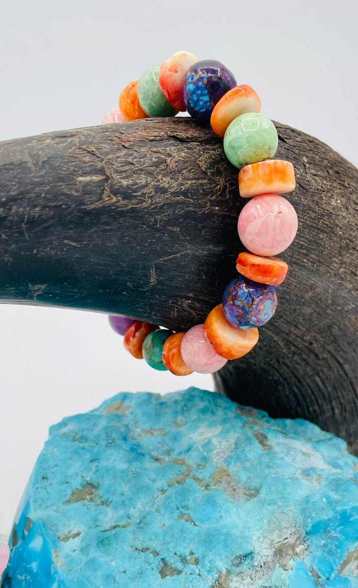 Stretch bracelet featuring Mojave turquoise, rhodochrosite, spiney oyster, variscite, sterling silver, phosphosiderite, and turquoise beads. Available only from Rockstar Cowgirl online or in store in Cody, Wyoming.