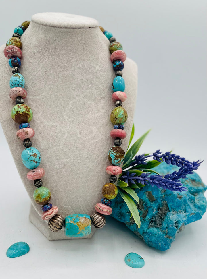 Beaded necklace featuring #8 turquoise, Kingman turquoise, purple Mojave turquoise, Rhodochrosite, and sterling silver beads. Available only from Rockstar Cowgirl online or  store in Cody, Wyoming.