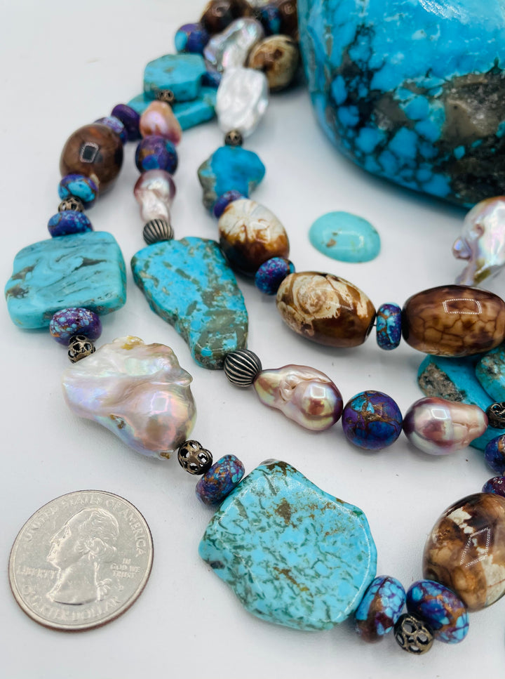 Beaded 3 strand necklace featuring Kingman turquoise slices, crazy lace agate, natural luster baroque pearls, and sterling silver beads. U.S. quarter for size reference. Available only from Rockstar Cowgirl online or in store in Cody, Wyoming.