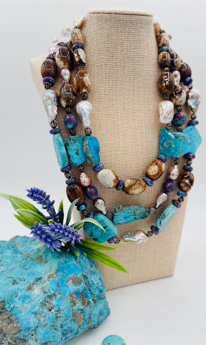 Beaded 3 strand necklace featuring Kingman turquoise slices, crazy lace agate, natural luster baroque pearls, and sterling silver beads. Available only from Rockstar Cowgirl online or in store in Cody, Wyoming.