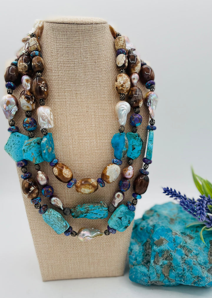 Beaded 3 strand necklace featuring Kingman turquoise slices, crazy lace agate, natural luster baroque pearls, and sterling silver beads. Available only from Rockstar Cowgirl online or in store in Cody, Wyoming.