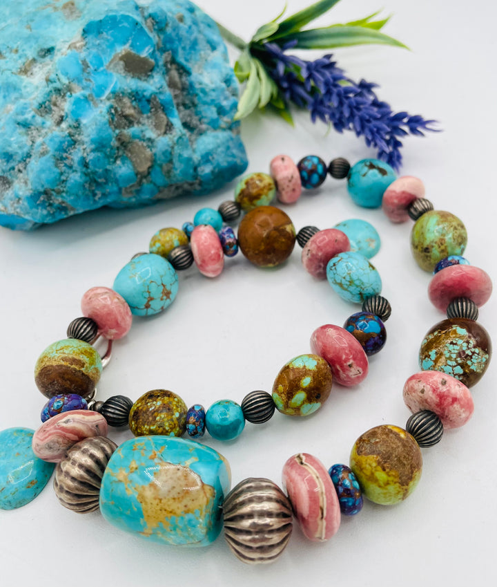 Beaded necklace featuring #8 turquoise, Kingman turquoise, purple Mojave turquoise, Rhodochrosite, and sterling silver beads. Available only from Rockstar Cowgirl online or  store in Cody, Wyoming.