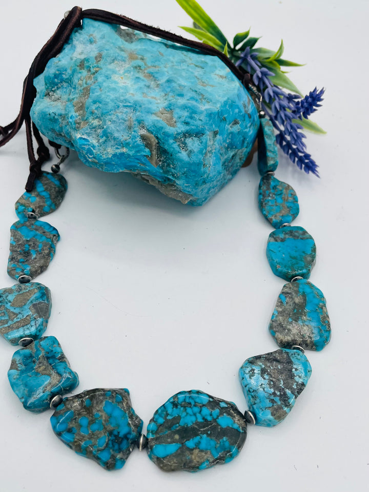 Adjustable beaded hatband that doubles as a necklace featuring Ithaca Peak turquoise and sterling silver beads finished with deer lace in  the back. Available only from Rockstar Cowgirl online or in store in Cody, Wyoming.