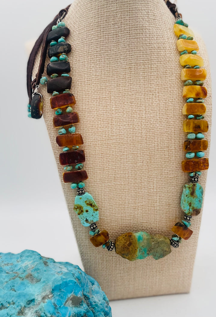 Adjustable beaded hatband featuring Kingman turquoise, Sonoran turquoise, Baltic amber with silver details, and finished with deer lace in the back. Available only from Rockstar Cowgirl online or in store in Cody, Wyoming.