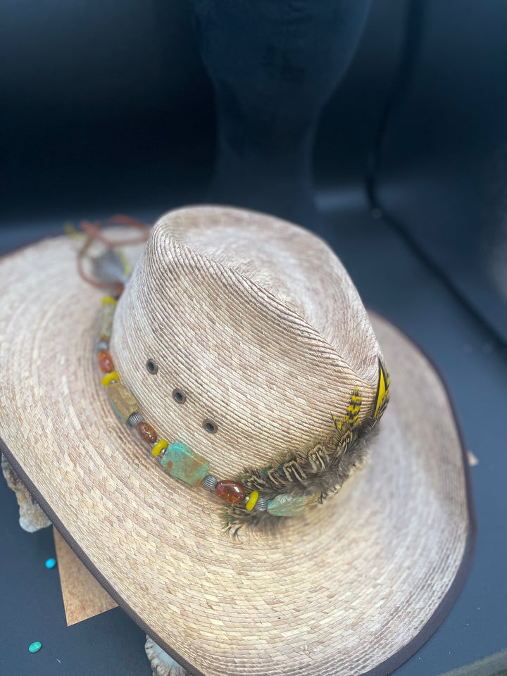 A side view of the hatband displaying the Kingman turquoise slices, Baltic amber, yellow African glass and sterling silver beads. Only available from Rockstar Cowgirl.