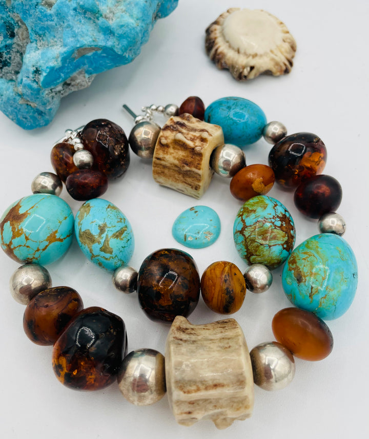 Chunky beaded necklace featuring Baltic amber, textured deer antler, sterling silver beads, and Kingman turquoise nuggets. Available only from Rockstar Cowgirl online or in store in Cody, Wyoming.