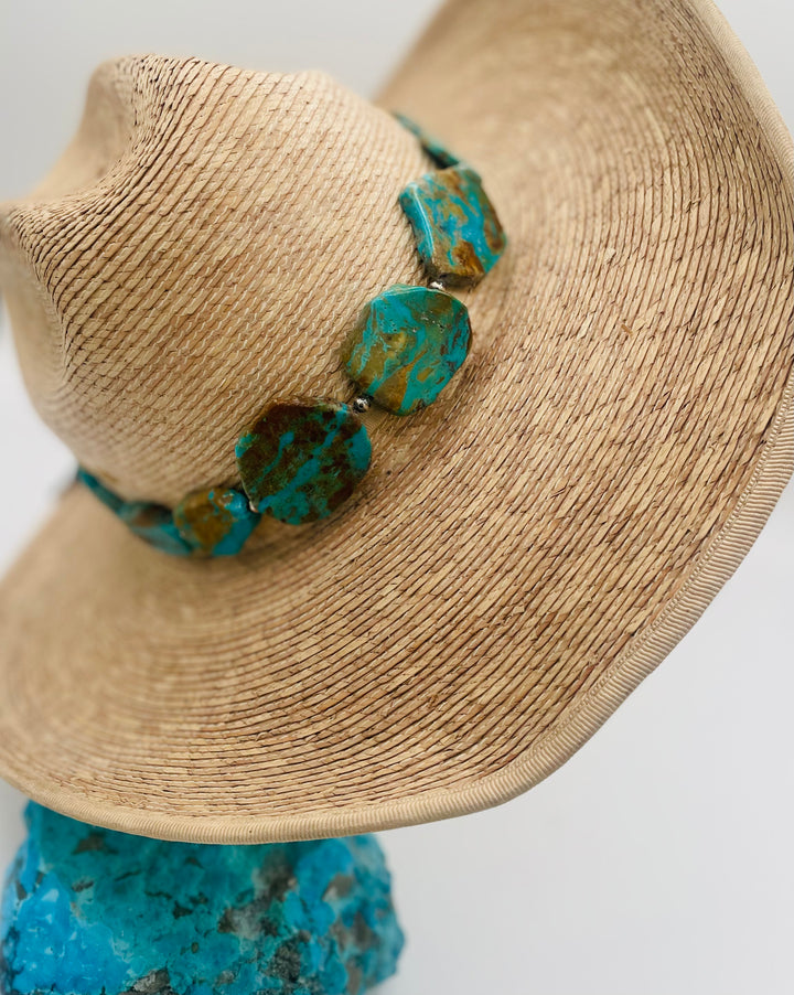 Adjustable beaded hatband featuring Kingman turquoise, and sterling silver beads finished with deer lace in the back. Available only from Rockstar Cowgirl online or in store in Cody, Wyoming.