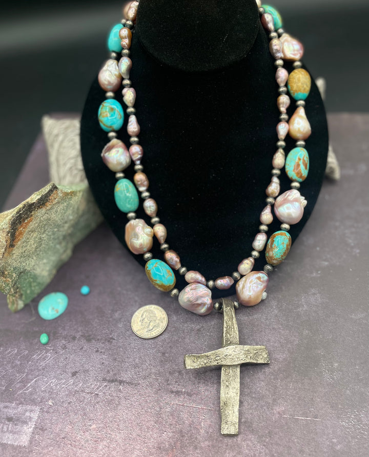 2 strand necklace featuring baroque natural luster pearls, Kingman turquoise nuggets, sterling silver beads, and sterling silver cross pendent. Available only from Rockstar Cowgirl online or in store in Cody, Wyoming.