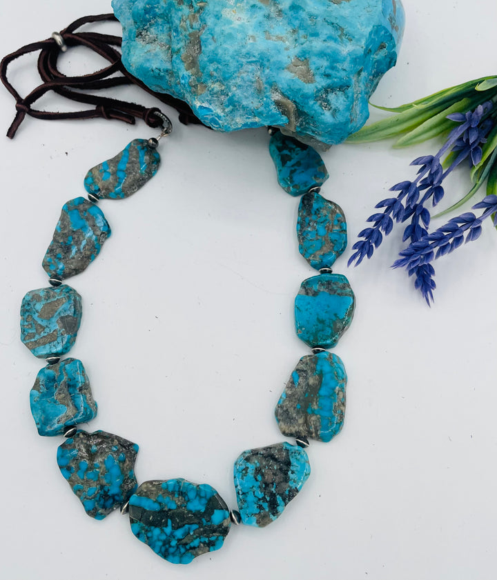 Adjustable beaded hatband that doubles as a necklace featuring Ithaca Peak turquoise and sterling silver beads finished with deer lace in  the back. Available only from Rockstar Cowgirl online or in store in Cody, Wyoming.