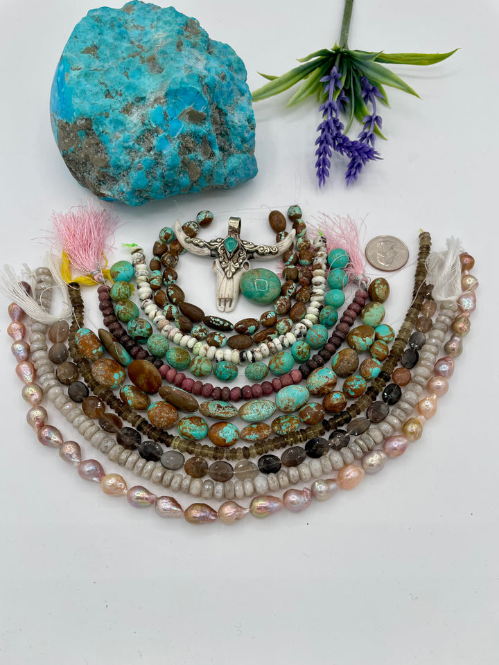 Bead box featuring #8 turquoise, Kingman turquoise, silverite, baroque natural luster pearls, moonstone, smokey quartz, rhodonite, chrysoprase, large Kingman nugget, and a steer pendent. One of a kind available only from Rockstar Cowgirl online or in store in Cody, Wyoming.