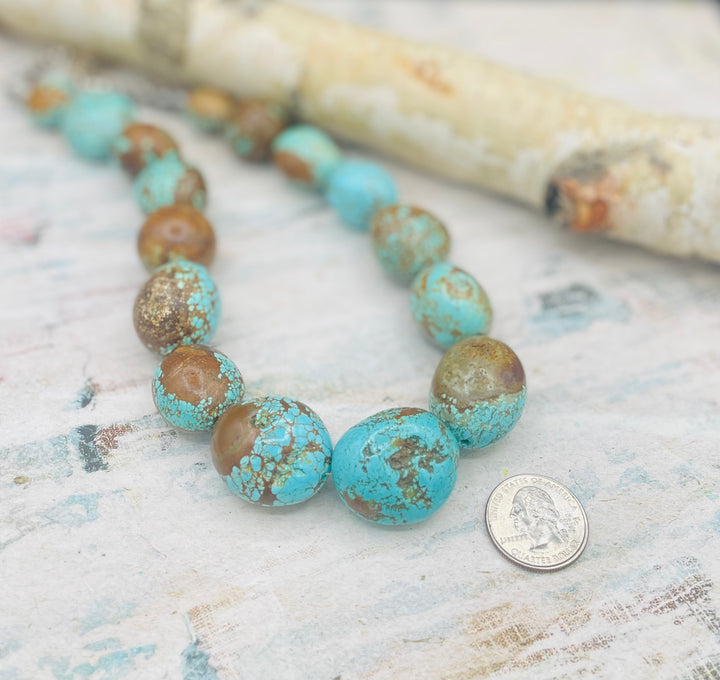 Close up of the largest #8 nuggets in the center of the necklace highlighting the matrix with a U. S. quarter for size reference. Available only from Rockstar Cowgirl online or in store in Cody, Wyoming.