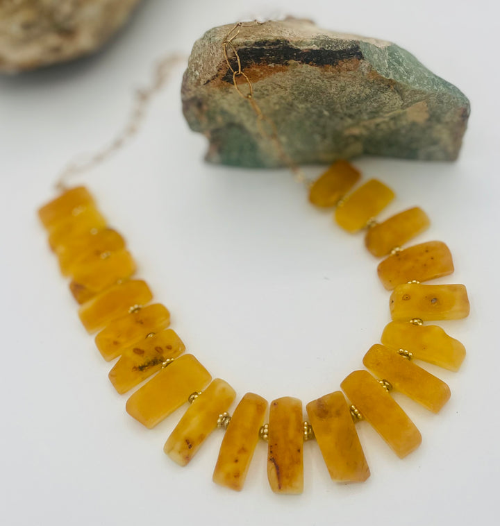 Beaded necklace featuring Baltic amber with gold details. Available only from Rockstar Cowgirl online or in store in Cody, Wyoming.
