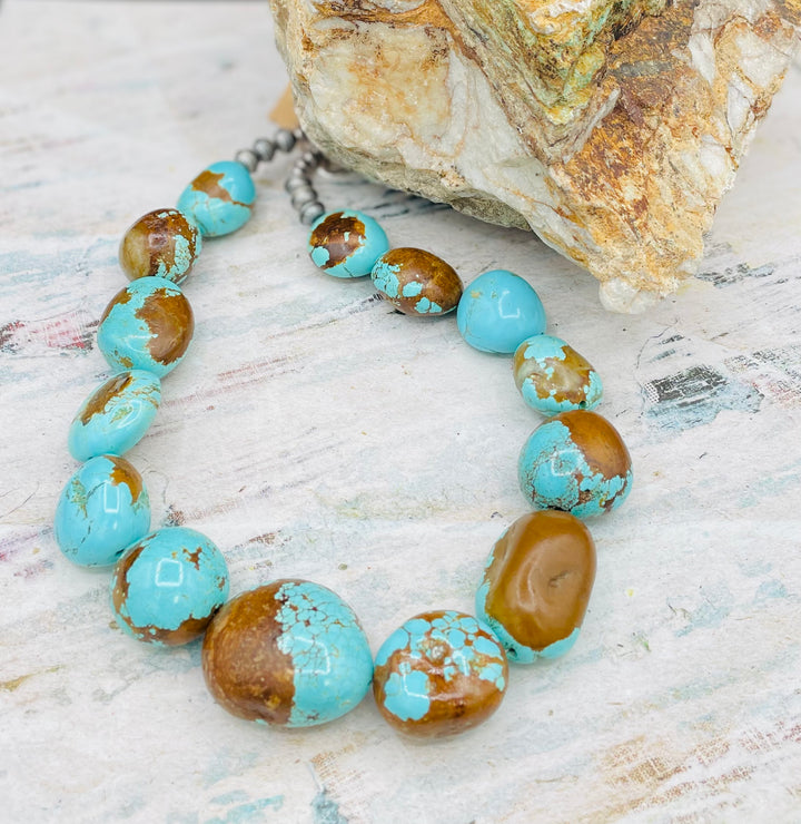 A close up highlighting the matrix in this #8 turquoise necklace only available from Rockstar Cowgirl online or in store in Cody, Wyoming.