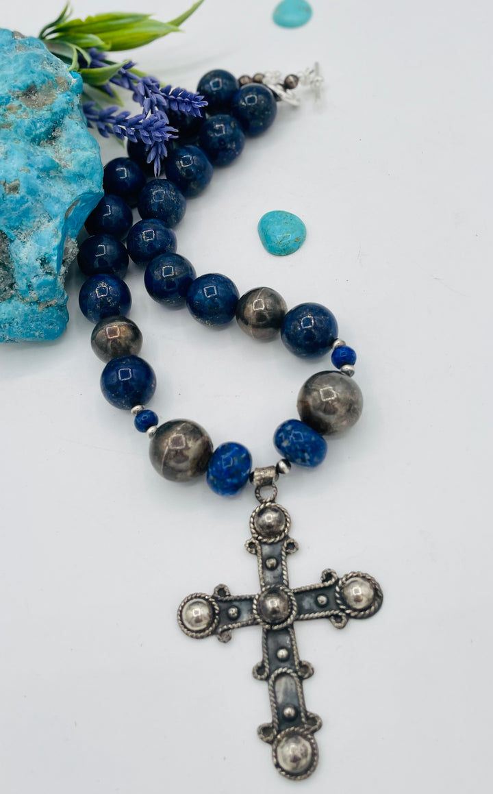 Chunky beaded necklace featuring lapis lazuli and sterling silver beads with a sterling silver cross. Available only from Rockstar Cowgirl online or in store in Cody, Wyoming.