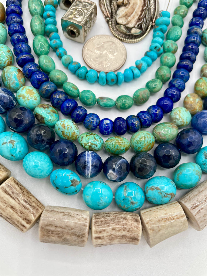 Bead box featuring strands of Kingman turquoise in blue and green, sodalite, denim lapis, Campitios turquoise, repousse beads, and hand carved bone horse pendent in Bali silver. U.S. quarter for size reference. One of a kind box available only from 
Rockstar Cowgirl online or in store in Cody, Wyoming.
