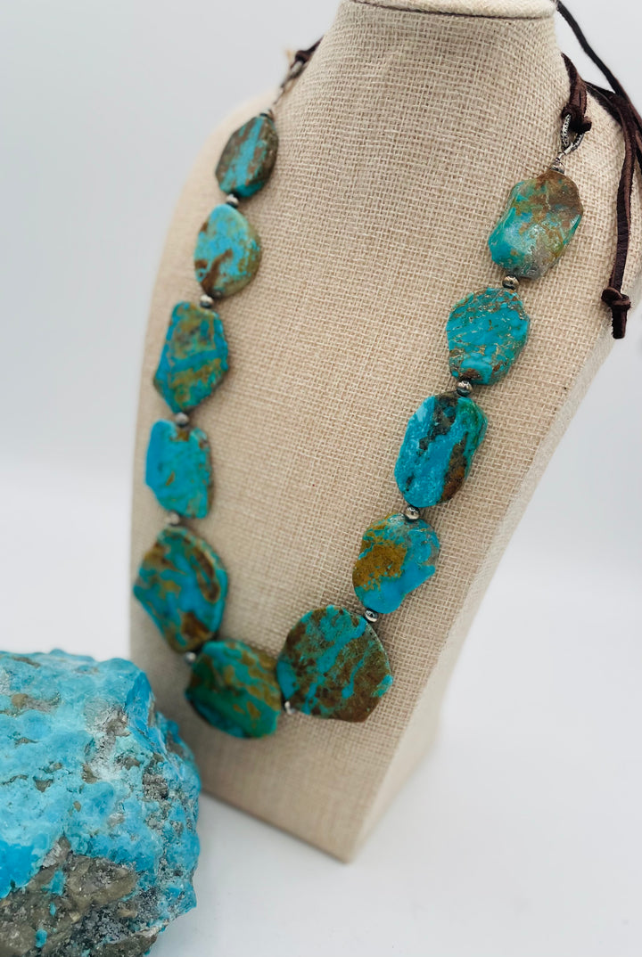 Adjustable beaded hatband featuring Kingman turquoise, and sterling silver beads finished with deer lace in the back. Available only from Rockstar Cowgirl online or in store in Cody, Wyoming.