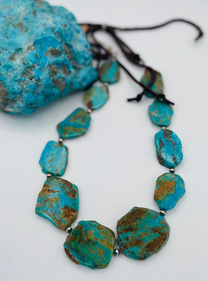 Adjustable beaded hatband featuring Kingman turquoise, and sterling silver beads finished with deer lace in the back. Available only from Rockstar Cowgirl online or in store in Cody, Wyoming.