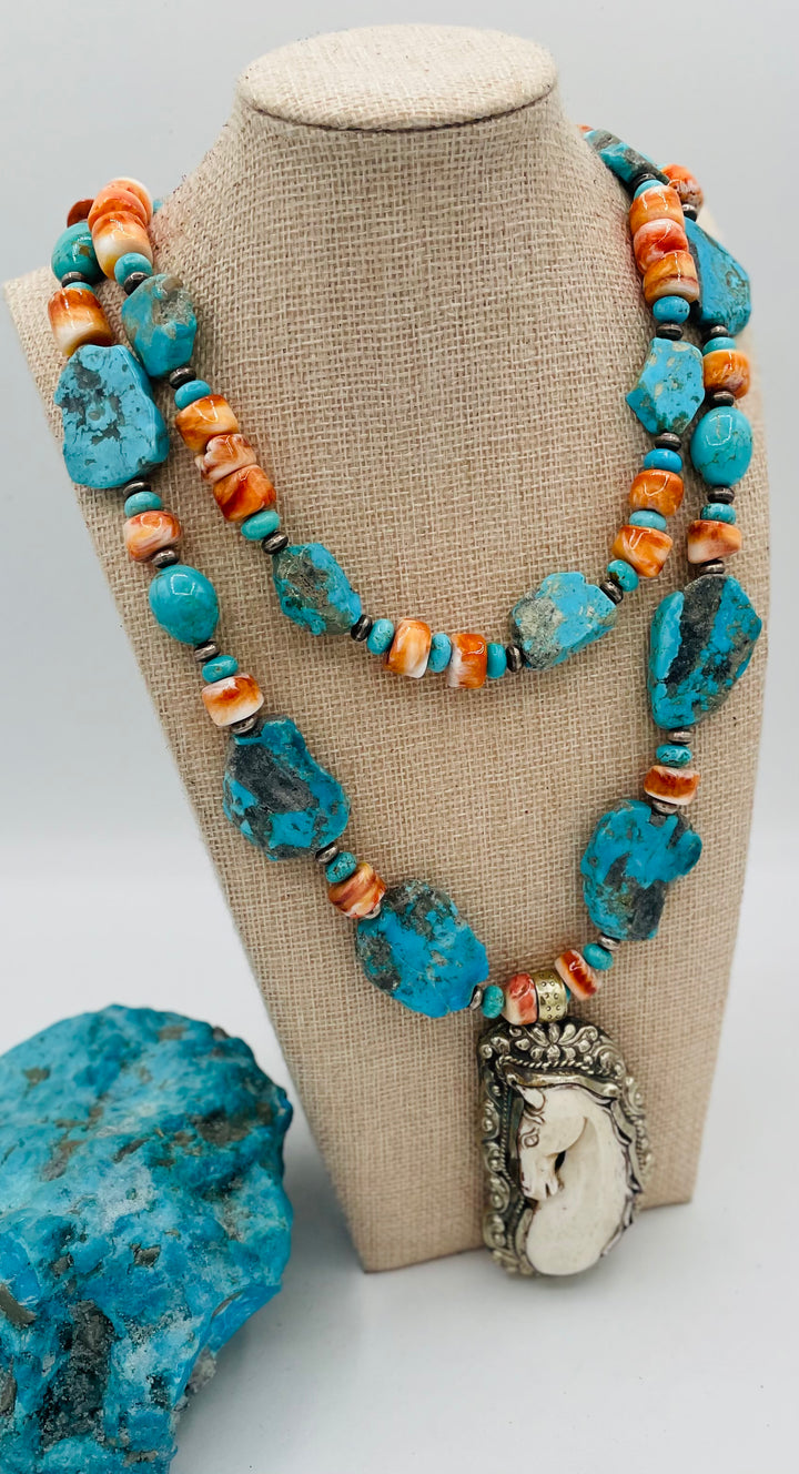 Beaded 2 strand necklace featuring Kingman turquoise, spiney oyster, sterling silver beads, with a bone and Bali silver horse pendent. Available only from Rockstar Cowgirl online or in store in Cody, Wyoming.