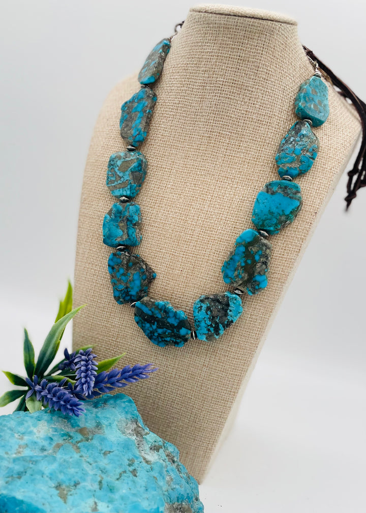 Adjustable beaded hatband that doubles as a necklace featuring Ithaca Peak turquoise and sterling silver beads finished with deer lace in  the back. Available only from Rockstar Cowgirl online or in store in Cody, Wyoming.