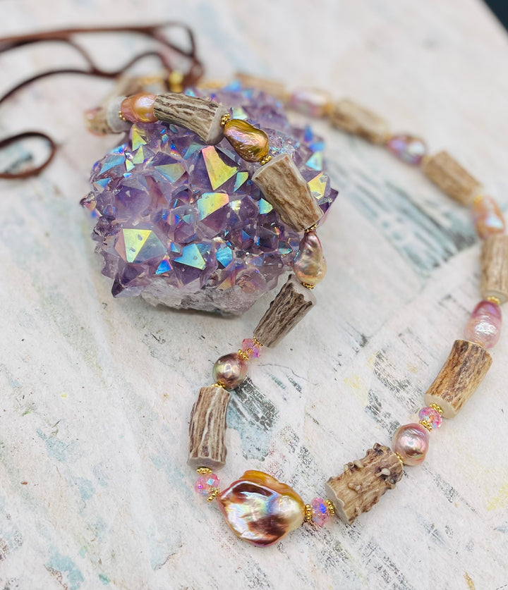 Baroque natural luster pearl, knobby deer antlers beads and vintage Swarovski crystal hatband. Finished with Deer lace and slide bead for adjustability. Available only from Rockstar Cowgirl online or in store in Cody, Wyoming.