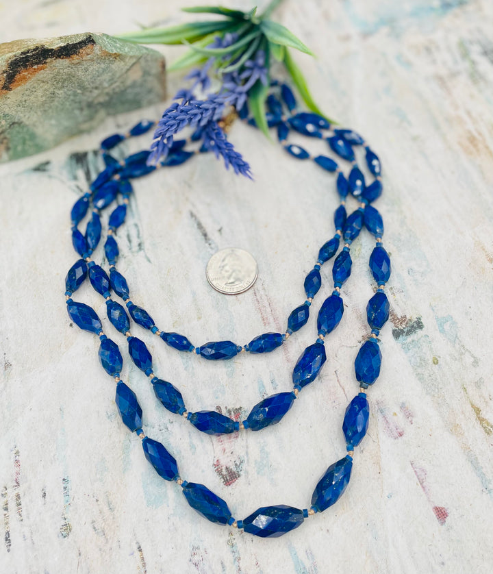 3 strand nested Afghan lapis beads silk knotted on gold silk necklace. U. S. quarter for size reference. Available only from Rockstar Cowgirl online or in store in Cody, Wyoming.