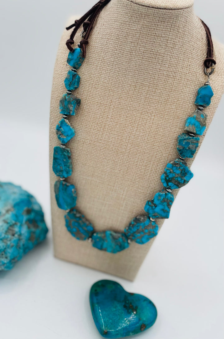 Adjustable beaded hatband that doubles as a necklace featuring Ithaca Peak turquoise and sterling silver beads and finished with deer lace in the back. Available only from Rockstar Cowgirl online or in store in Cody,, Wyoming.