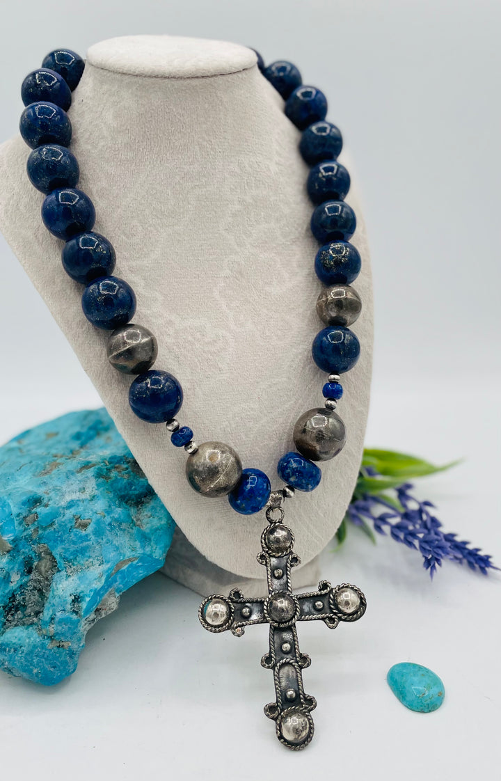 Chunky beaded necklace featuring lapis lazuli and sterling silver beads with a sterling silver cross. Available only from Rockstar Cowgirl online or in store in Cody, Wyoming.