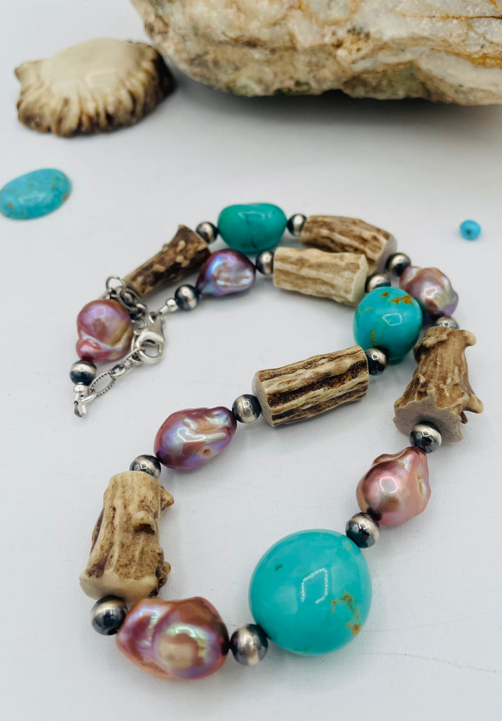 Beaded necklace featuring Kingman turquoise nuggets, baroque natural luster pearls, textured deer antler, and sterling silver beads. Available only from Rockstar Cowgirl online or in store in Cody, Wyoming.