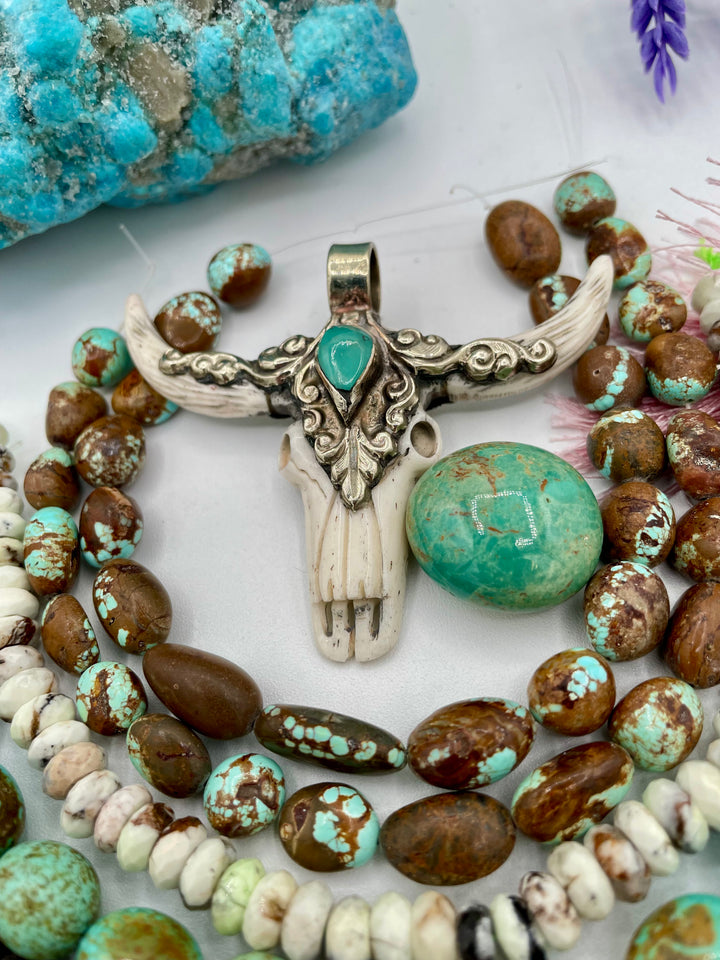 Bead box featuring #8 turquoise, Kingman turquoise, silverite, baroque natural luster pearls, moonstone, smokey quartz, rhodonite, chrysoprase, large Kingman nugget, and a steer pendent. One of a kind available only from Rockstar Cowgirl online or in store in Cody, Wyoming.