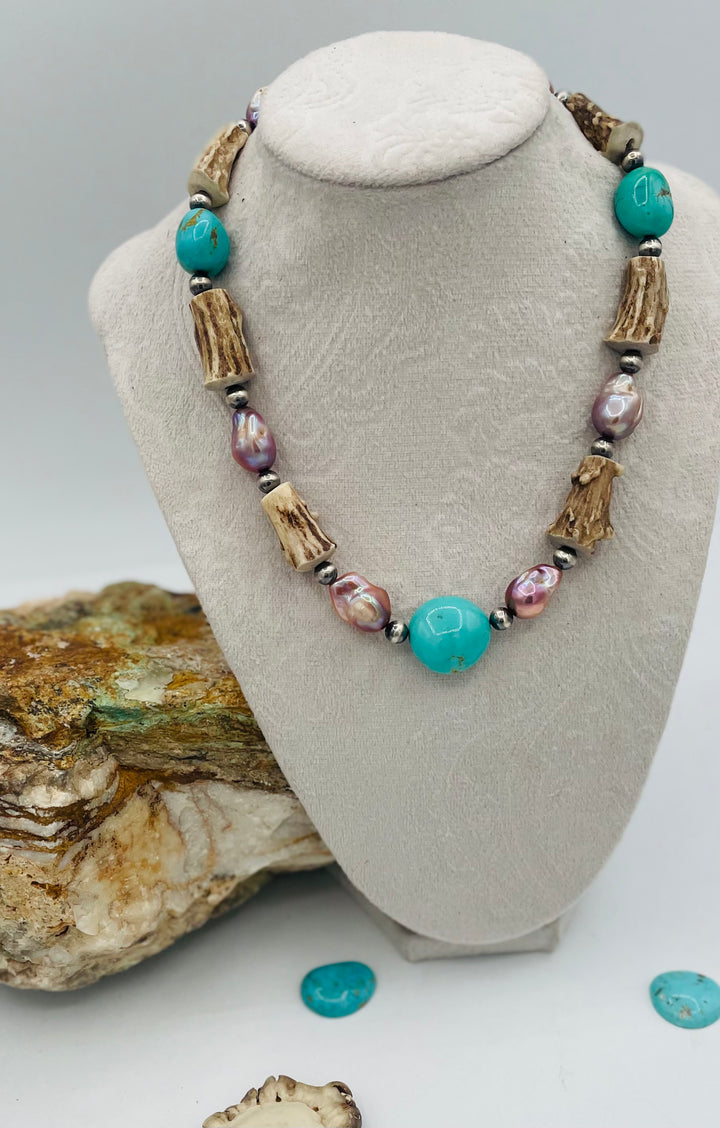Beaded necklace featuring Kingman turquoise nuggets, baroque natural luster pearls, textured deer antler, and sterling silver beads. Available only from Rockstar Cowgirl online or in store in Cody, Wyoming.