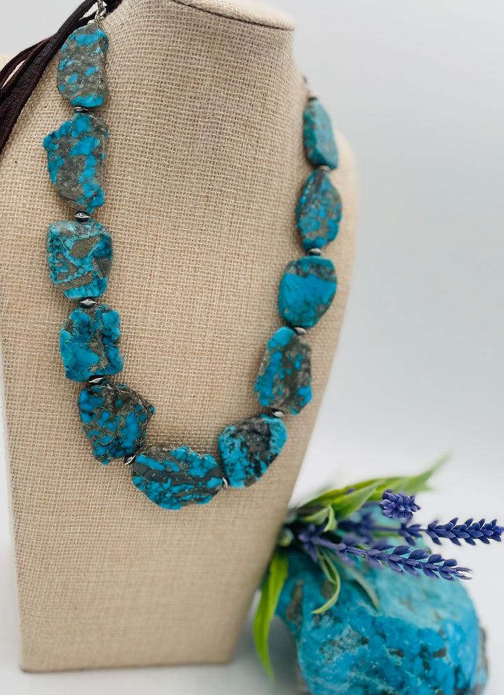 Adjustable beaded hatband that doubles as a necklace featuring Ithaca Peak turquoise and sterling silver beads finished with deer lace in  the back. Available only from Rockstar Cowgirl online or in store in Cody, Wyoming.