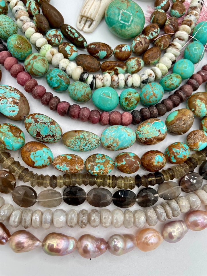 Bead box featuring #8 turquoise, Kingman turquoise, silverite, baroque natural luster pearls, moonstone, smokey quartz, rhodonite, chrysoprase, large Kingman nugget, and a steer pendent. One of a kind available only from Rockstar Cowgirl online or in store in Cody, Wyoming.