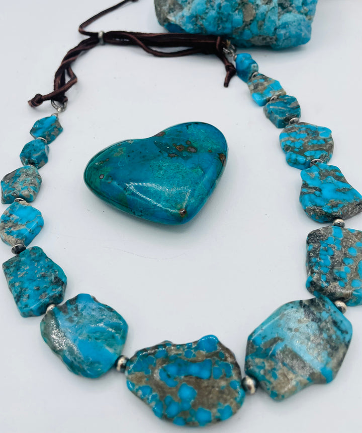 Adjustable beaded hatband that doubles as a necklace featuring Ithaca Peak turquoise and sterling silver beads and finished with deer lace in the back. Available only from Rockstar Cowgirl online or in store in Cody,, Wyoming.