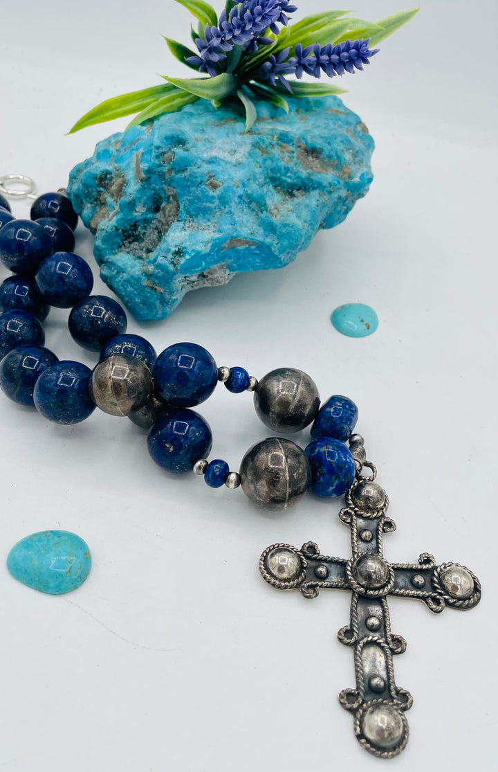 Chunky beaded necklace featuring lapis lazuli and sterling silver beads with a sterling silver cross. Available only from Rockstar Cowgirl online or in store in Cody, Wyoming.