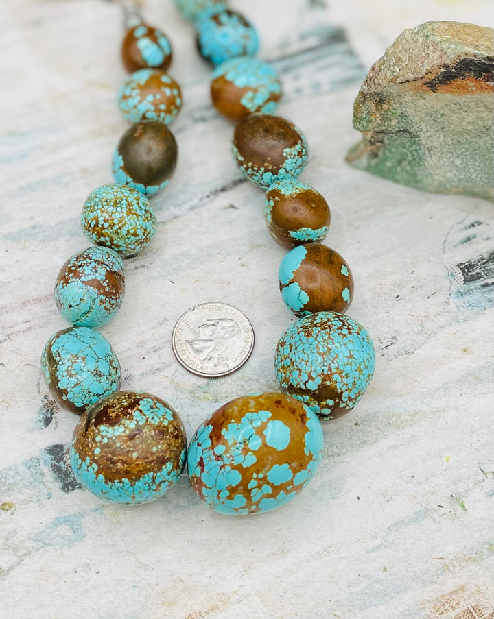 Giant #8 turquoise nuggets and sterling silver beaded necklace. U.S. quarter for size reference. Available only from Rockstar Cowgirl online or in store in Cody, Wyoming.