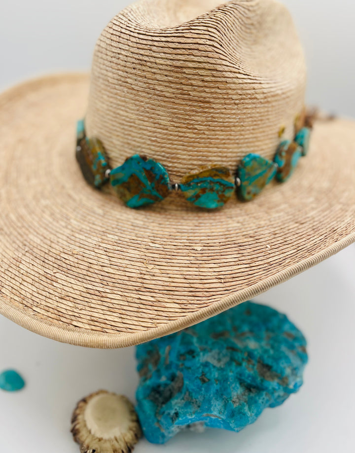 Adjustable beaded hatband that double as a necklace featuring Kingman turquoise flats and sterling silver beads finished with deer lace in the back. Available only from Rockstar Cowgirl online or in store in Cody, Wyoming.