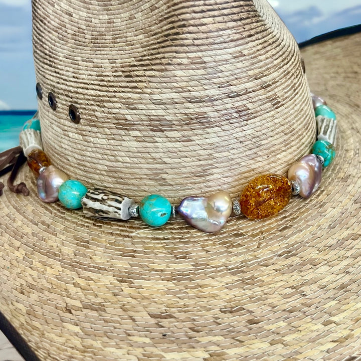 Close up of the front of the hatband showcasing the large Baltic amber, baroque natural luster pearls, deer antler, and sterling silver beads. Available only from Rockstar Cowgirl online or in store in Cody, Wyoming