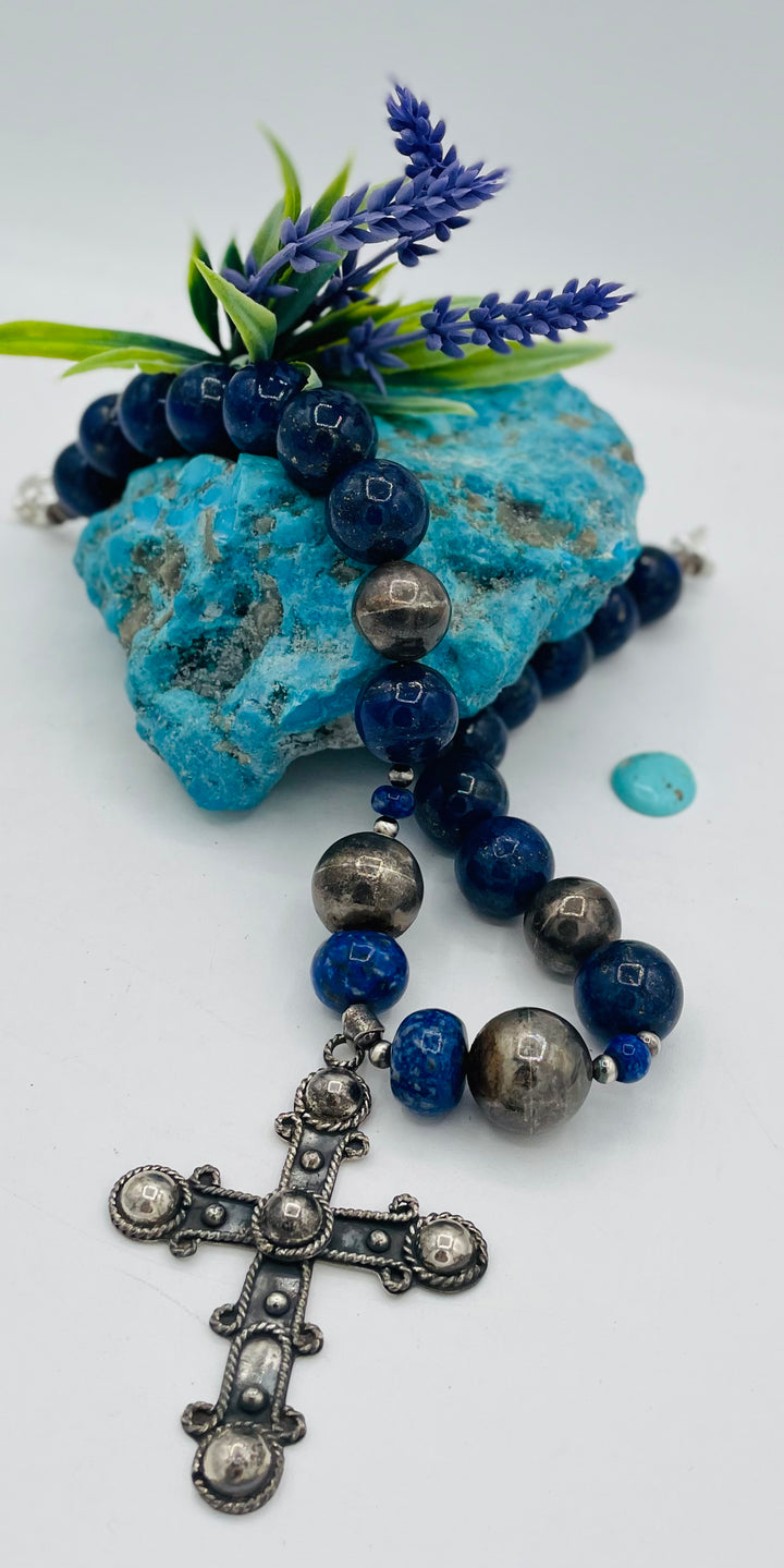 Chunky beaded necklace featuring lapis lazuli and sterling silver beads with a sterling silver cross. Available only from Rockstar Cowgirl online or in store in Cody, Wyoming.