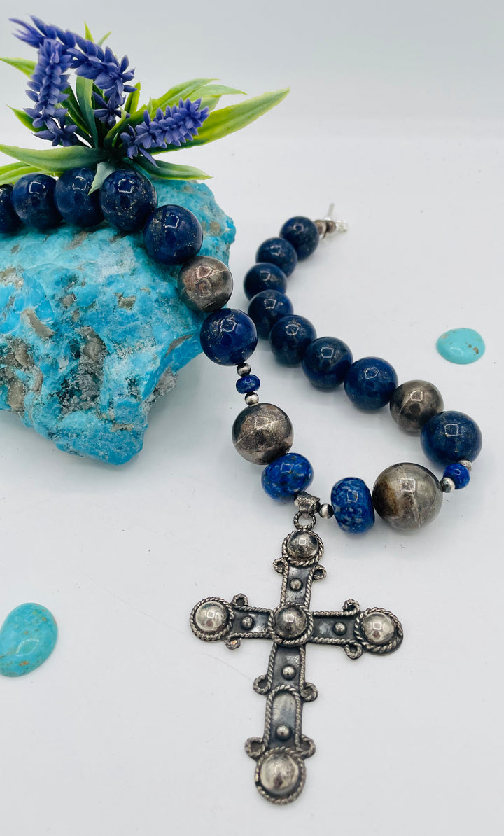 Chunky beaded necklace featuring lapis lazuli and sterling silver beads with a sterling silver cross. Available only from Rockstar Cowgirl online or in store in Cody, Wyoming.