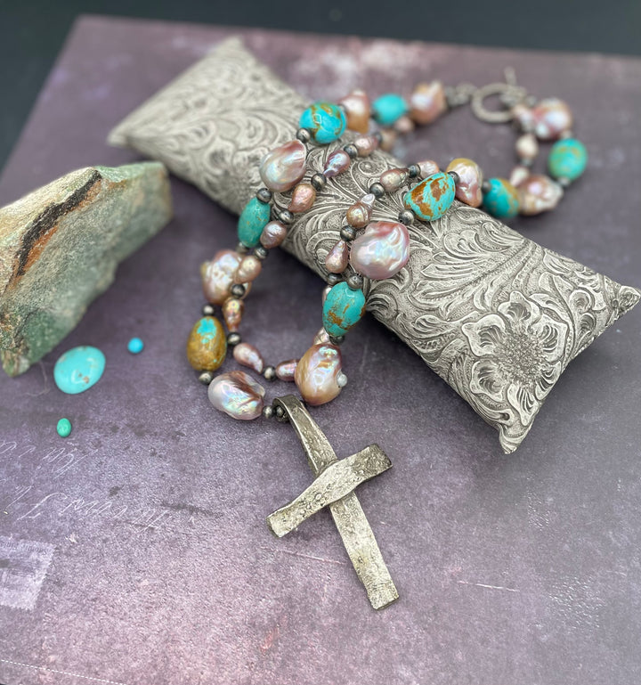 2 strand necklace featuring natural luster baroque pearls, Kingman turquoise nuggets, sterling silver beads, and handmade sterling silver cross pendent. Available only from Rockstar Cowgirl online or in store in Cody, Wyoming.