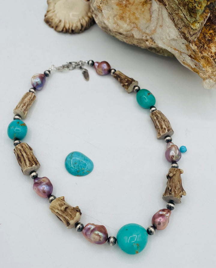Beaded necklace featuring Kingman turquoise nuggets, baroque natural luster pearls, textured deer antler, and sterling silver beads. Available only from Rockstar Cowgirl online or in store in Cody, Wyoming.