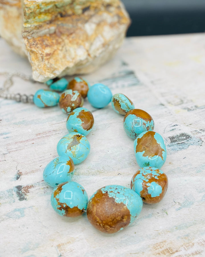 A close up of the largest center beads displaying the matrix and bright blues of the the #8 Turquoise beads. Available from Rockstar Cowgirl online or in store in Cody, Wyoming.