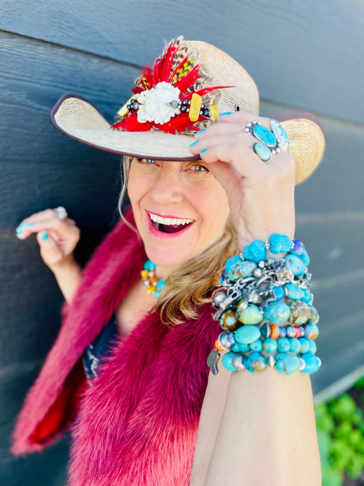 Close up of the red feather burst and antler crown on the front of the hatband. Available only from Rockstar Cowgirl online or in store in Cody, Wyoming.