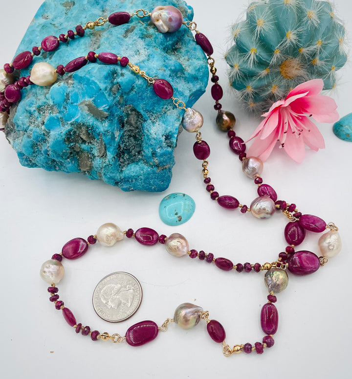 Silk knotted treasure necklace featuring rubies and natural luster Edison pearls. U.S. quarter for size reference. Available only from Rockstar Cowgirl online or in store in Cody, Wyoming.