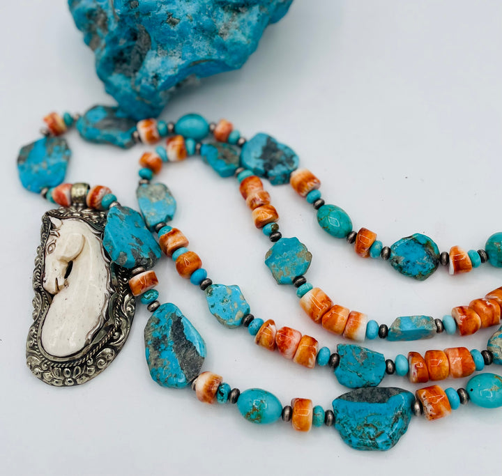 Beaded 2 strand necklace featuring Kingman turquoise, spiney oyster, sterling silver beads, with a bone and Bali silver horse pendent. Available only from Rockstar Cowgirl online or in store in Cody, Wyoming.