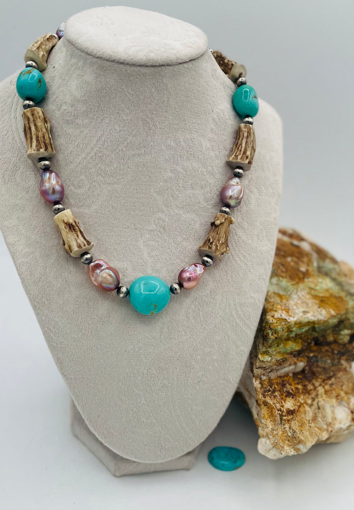 Beaded necklace featuring Kingman turquoise nuggets, baroque natural luster pearls, textured deer antler, and sterling silver beads. Available only from Rockstar Cowgirl online or in store in Cody, Wyoming.